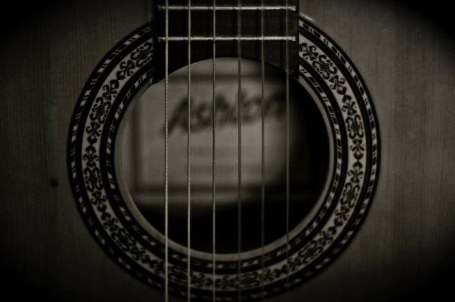 photo of grayscale guitar strings